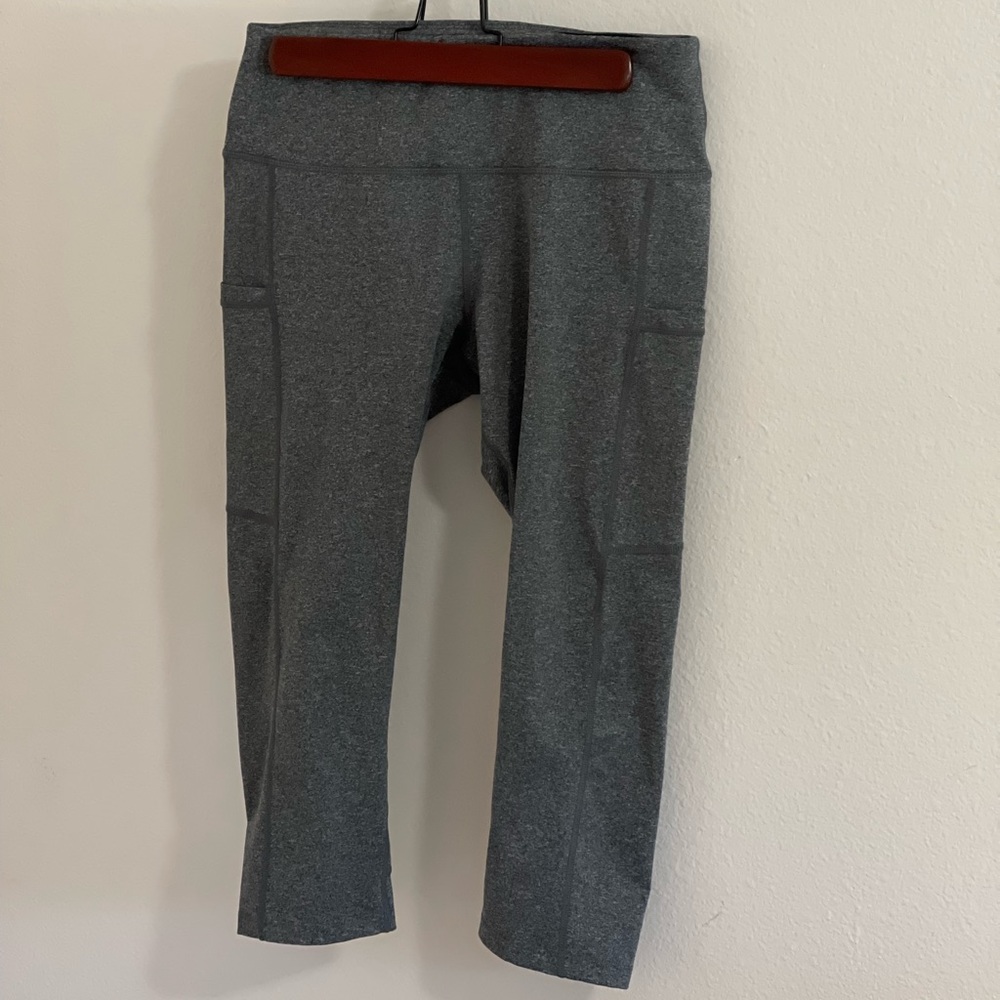 New without tags. Baleaf Capri leggings with side pockets. Size M